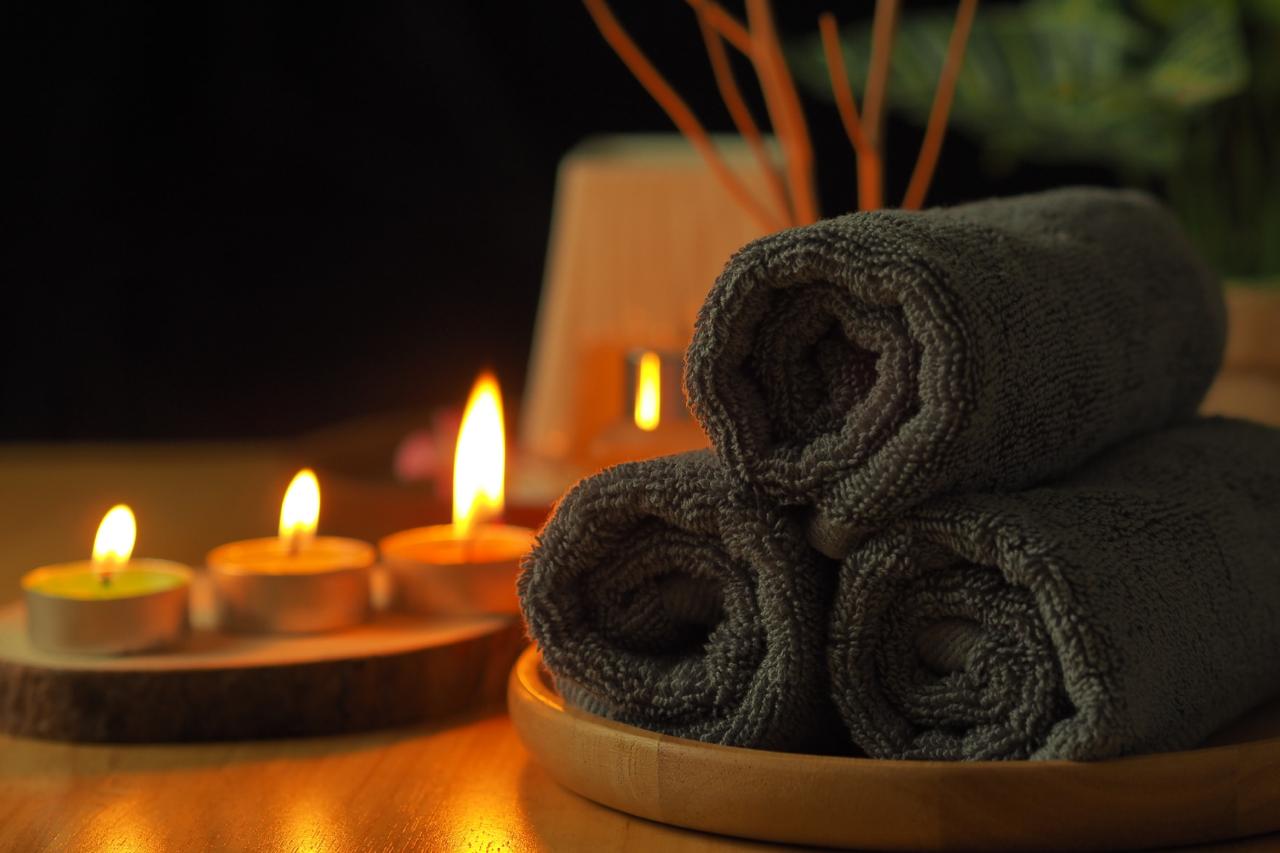 Spa towels and candles representing more than 15 years of wellness care